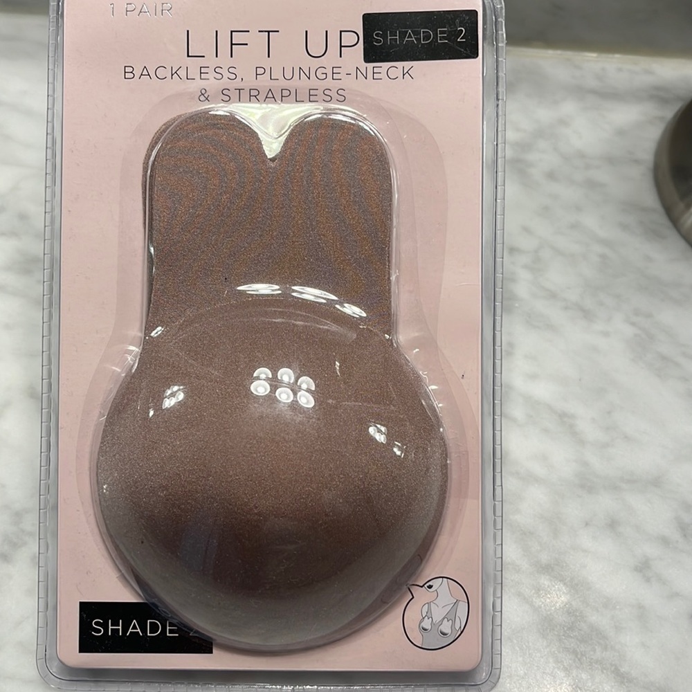 Lift up. Nipple cover